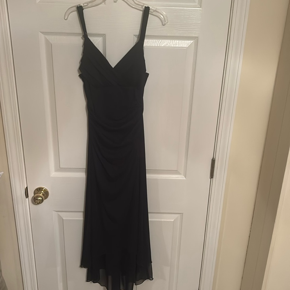 Trixie clothing company stunning black dress in medium slim fit.